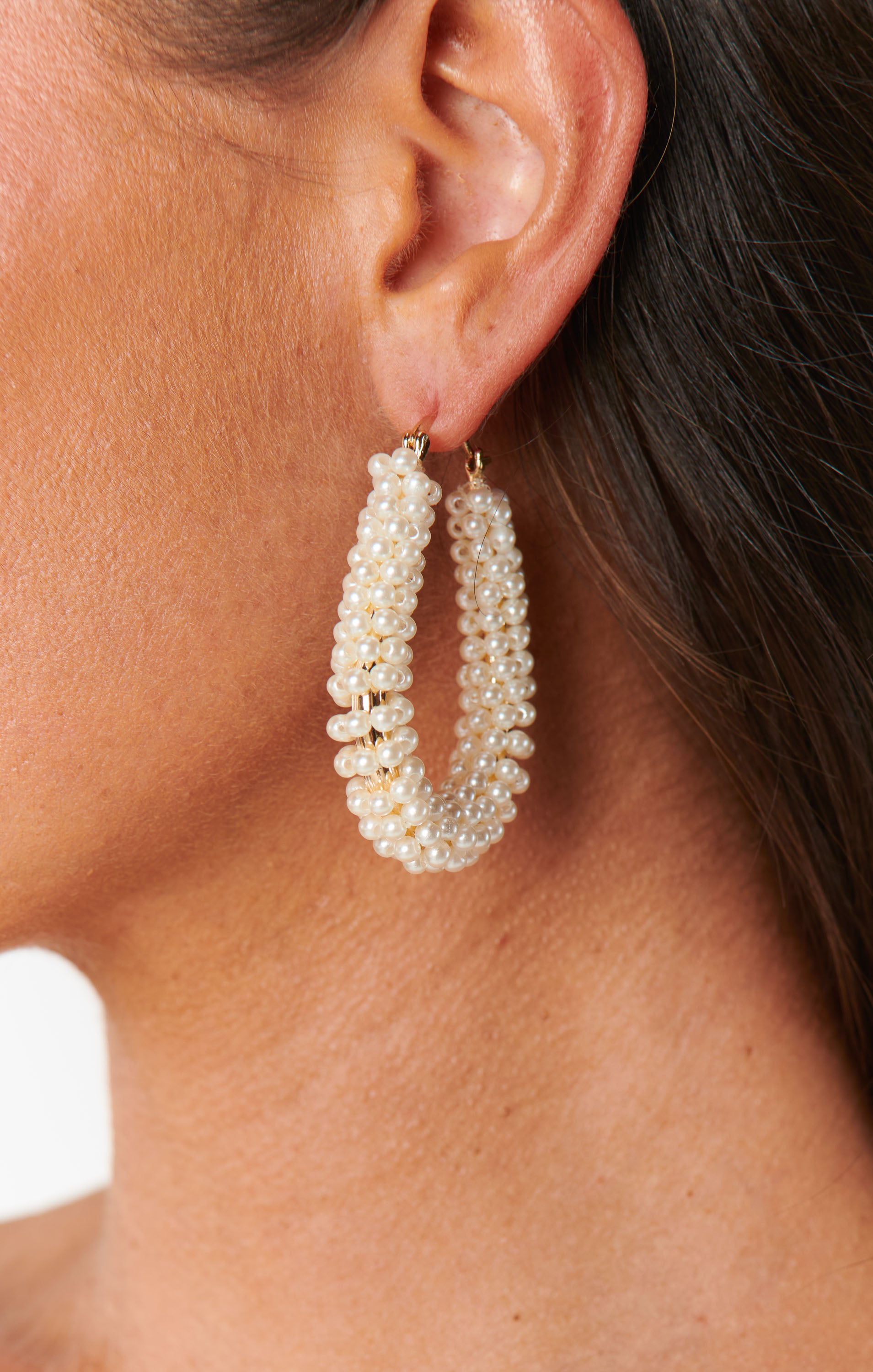 Pearl Hoop Earrings with Glamorous Swoop Design | Ettika